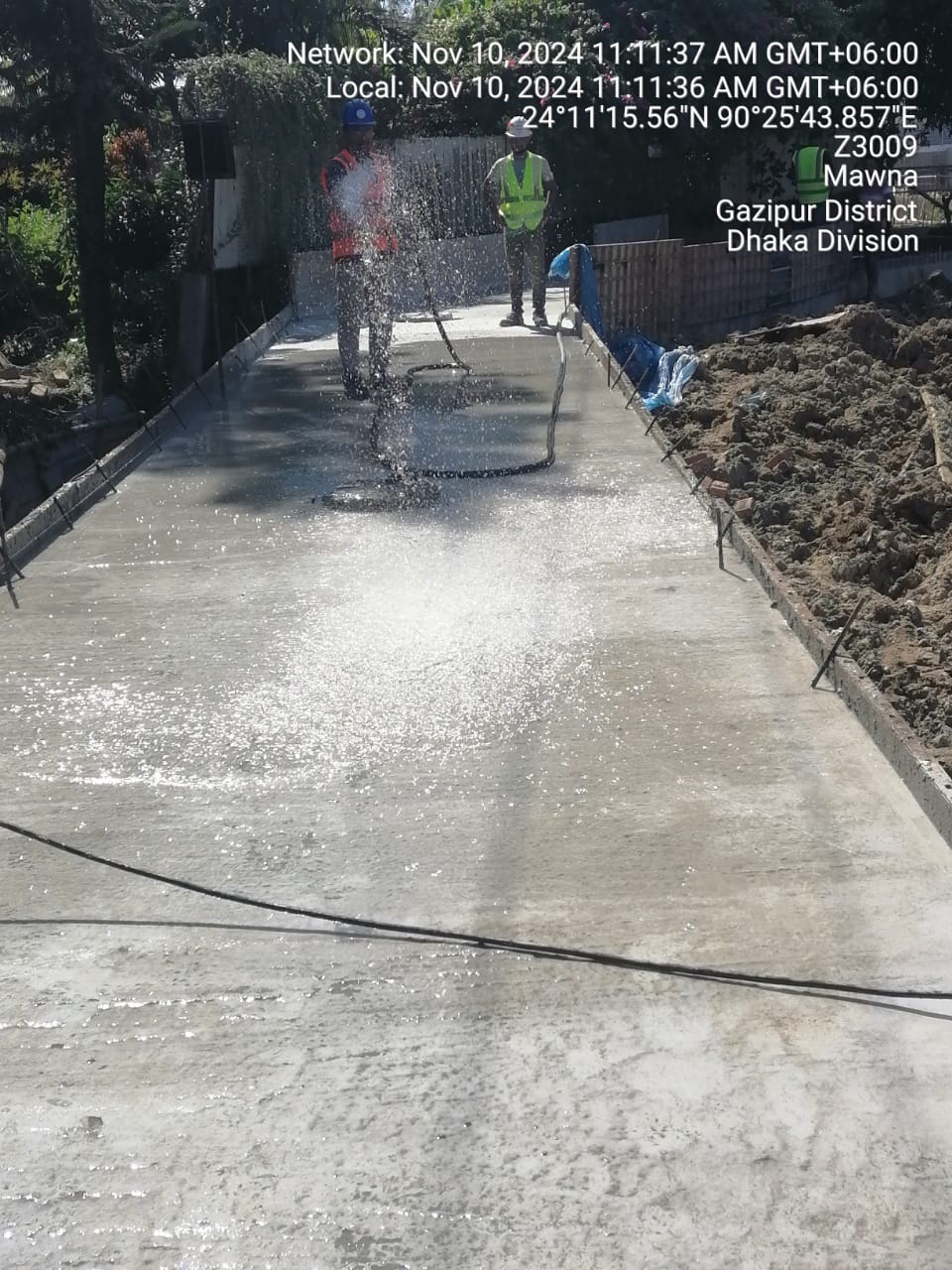 Early-age curing of slab by water spray to prevent plastic shrinkage cracking