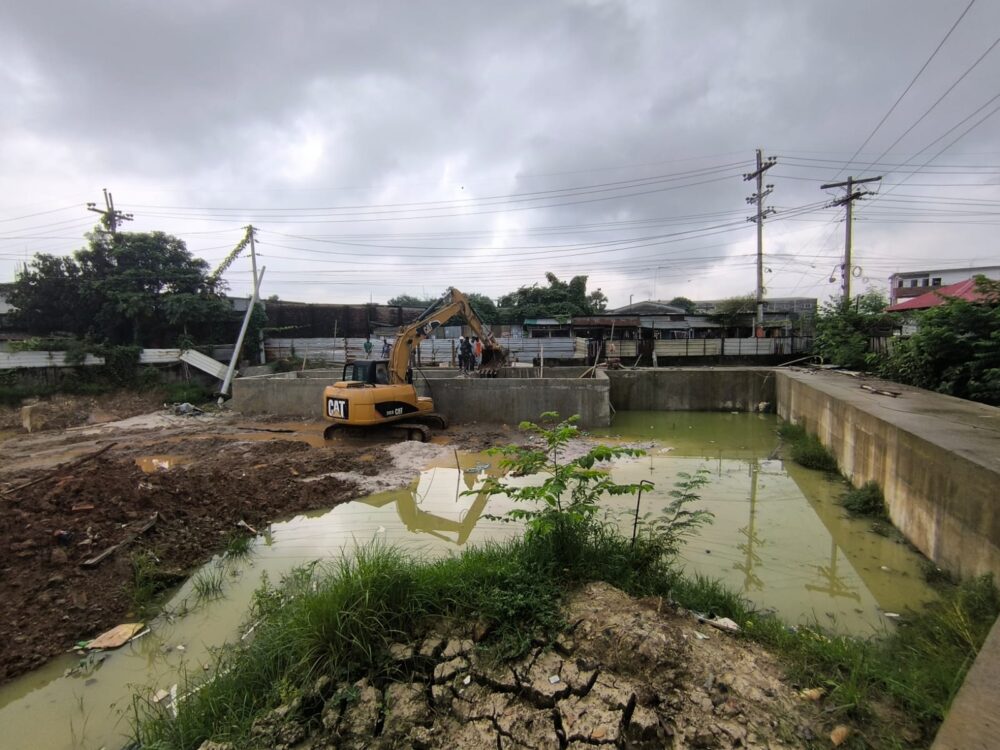 Completed hydraulic structures—overflow tank and culvert—within How Are You (HAY) textile campus