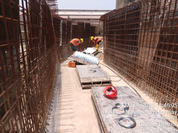 Curved twin-wall reinforcement prepared for shuttering along factory boundary