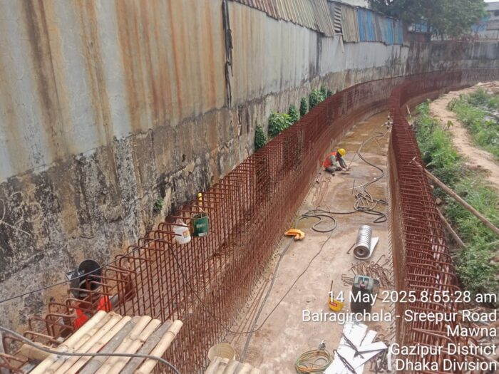 Long curved channel under reinforcement demonstrating hydraulic continuity design